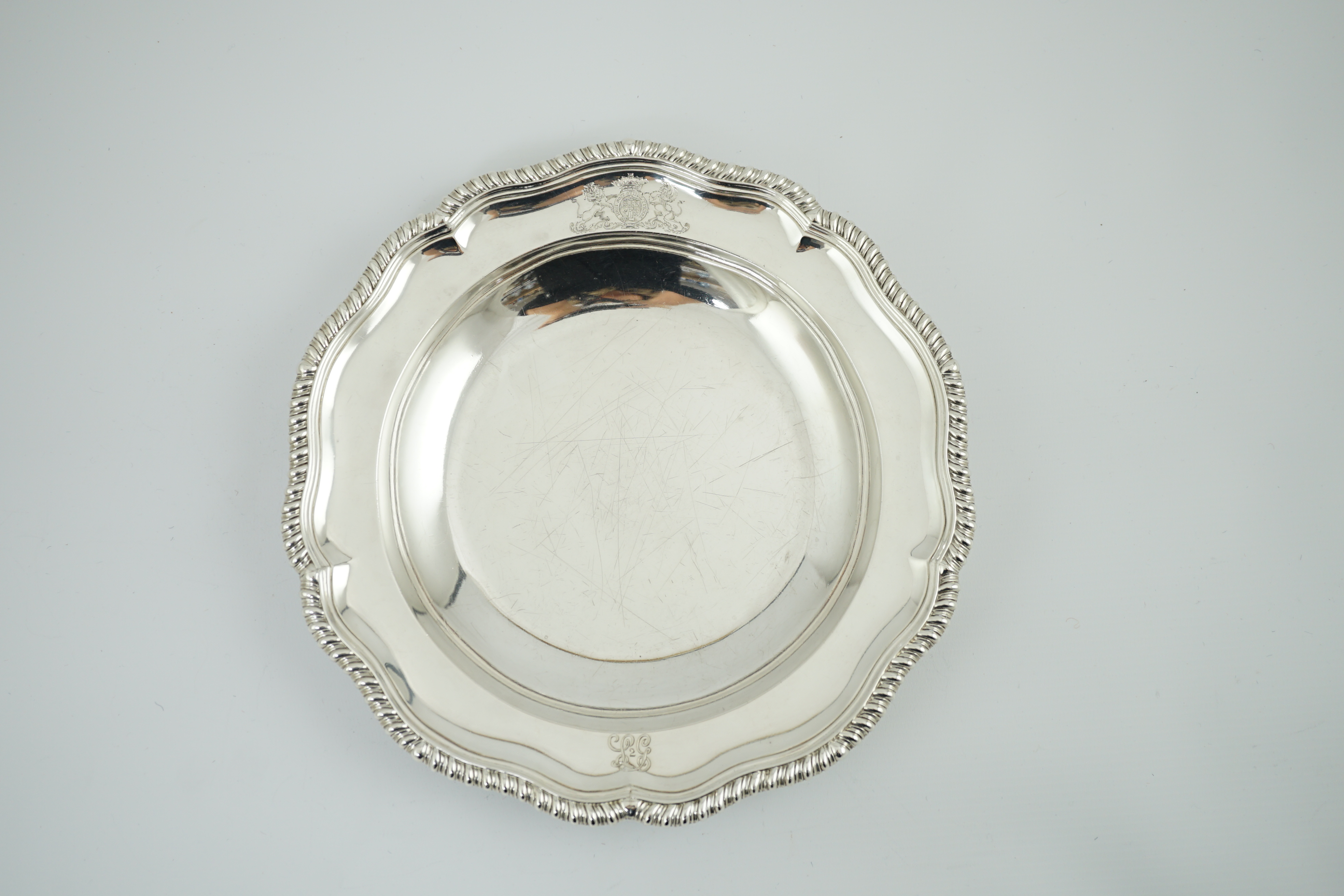 A George IV silver soup plate, by William Eaton